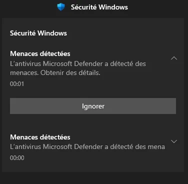 Notification Sécurité Windows : « Menaces détectées, l'antivirus Microsoft Defender a détecté des menaces », deux alertes successives.